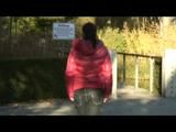 Enni taking a walk while wearing a sexy red down jacket and a shorts beneath the jeans (Video)