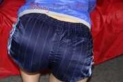 Watching sexy Sonja wearing a supersexy oldschool blue shiny nylon shorts and a lightblue rain jacket during her workout with barbells (Pics)