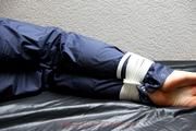 Shelly tied and gagged in shiny nylon pants and a shiny nylon dowjacket