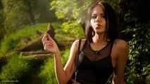 18 years old Tanya is smoking 120mm cork cigarette outdoors