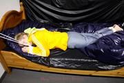 Samanthy bound and gagged in shiny nylon rainwear