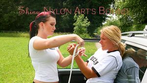 An archive girl tied, gagged and kidnaped by another archive girl by car wearing shiny nylon shorts (Pics)