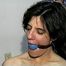 26 Yr OLD K-MART CLERK IS BALL-GAGGED, HANDGAGGED, TIT TIED, CROTCH ROPED PUSSY, GROPED, DROOLING, WHILE TIGHTLY TIED NAKED TO A CHAIR (D66-1)