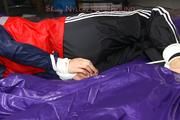 Samantha tied and gagged on bed wearing shiny nylon rainwear (Pics)