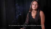Asya is giving an interview while smoking two cigarettes