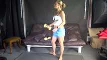 Watching sexy Sandra wearing a sexy lightblue shiny nylon shorts and a white top during her workout with barbells (Video)