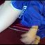 Lucy ties and gagges herself on a sofa with cuffs wearing a sexy blue shiny nylon shorts and a rain jacket (Video)