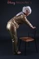 Blonde archive girl posing in a studio wearing a sexy golden rainwear combination (Pics)