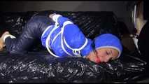 SANDRA tied, gagged and hooded with ropes and a ballgag on a sofa wearing sexy rainwear (Video)