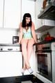 Heels crushing pineapple in the kitchen
