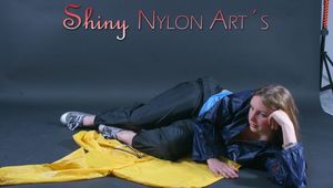 Anastasia posing in a foto studio wearing supersexy oldschool blue rainwear (Pics)