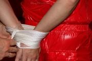 Isabelle tied and gagged in shiny nylon clothes