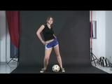 Archive girl posing with a soccer ball wearing a sexy blue shiny nylon shorts and a top (Video)