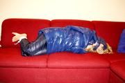 Samantha bound and gagged in a shiny nylon down coat