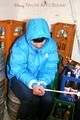 Jill tied and gagged in a refrigeration room wearing a blue shiny nylon down jacket and a black rain pants (Pics)