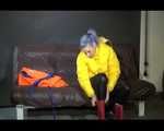 Sexy Mara trying on her new yellow down jacket and her lifevest in combination with a sexy shiny black rain pants and rubber boots (Video)