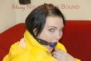 Jill ties, gagges and hoodes herself wearing a shiny yellow down jacket and a yellow rain pants(Pics)