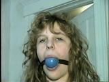 19 Yr OLD SINGLE MOM RONI IS WRAP CLEAVE GAGGED WITH AN ACE BANDAGE, HANDGAGGED, MOUTH STUFFED, BALL-GAGGED & TIED BACKWARDS TO A CHAIR (D53-9)