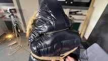 Marie bound and gagged in a shiny nylon Downjacket