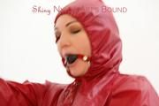 Jill ties, gagges and hoodes herself in front of a mirror and in an strairway wearing a sexy shiny nylon rain pants in black and a red rain jacket (Pics)