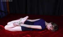 Agnes hogtied on bed