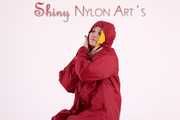 Watching sexy Jill wearing a sexy yellow shiny nylon rainwearcombination and a red shiny nylon raincoat posing for you (Pics)
