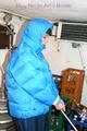 Jill tied and gagged in a refrigeration room wearing a blue shiny nylon down jacket and a black rain pants (Pics)