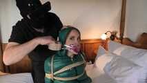 Rachel Adams tied and gagged in shiny Downwear