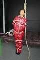 Watch Sandra enjoying Bondage in her shiny nylon Rainwear beeing noosed