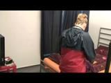Jenny preparing her bed and lolling in bed wearing sexy purple shiny nylon rainwear (Video)