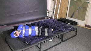 Lana tied and gagged in shiny nylon Rainwear desperately trying to free herself