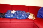Samantha bound and gagged in a shiny nylon down coat