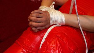 Isabelle tied and gagged in shiny nylon clothes