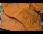 Sonja cleaning up the kitchen wearing a sexy black shiny nylon shorts and an orange rain jacket (Video)