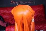 Watching Pia putting on a wonderful supersexy shiny nylon rainssuit in orange (Pics)