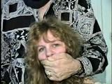 19 Yr OLD SINGLE MOM RONI IS WRAP CLEAVE GAGGED WITH AN ACE BANDAGE, HANDGAGGED, MOUTH STUFFED, BALL-GAGGED & TIED BACKWARDS TO A CHAIR (D53-9)