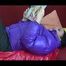 Jill wearing a blac rain pants and a purple down jacket feeling herself on a red sofa (Video)
