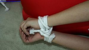 Angel hogtied in Lycra and topless
