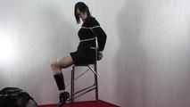 Daphne tied with ropes to the chair 2/2