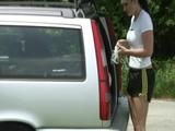 One of our archive girls ties and gagges the other one outdoor in car wearing shiny nylon shorts (Video)