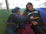 Two archive girls tied and gagged with tape on the floor wearing shiny nylon rainwear (Video)
