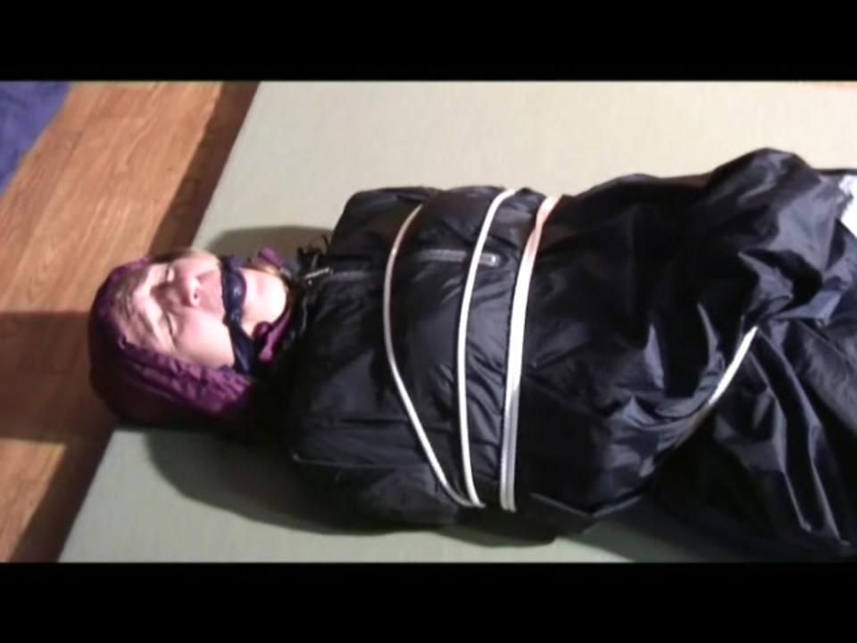 03:30 Min. Video With Katharina Tied And Gagged In Two Layers Of Shiny Nylon Rainwear