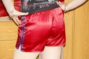 Mara putting on several shiny nylon shorts and posing infront of the camera (Pics)