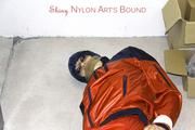 Shelly tied and gagged in shiny nylon rainwear