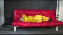 Watching Mara putting on sexy yellow shiny nylon rainwear lolling on the sofa (Video)