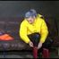Watching Mara putting on a down jacket, rubber boots and a lifevest (Video)