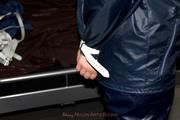 Simone tied and gagged in a shiny nylon rainsuit and a shiny nylon cape
