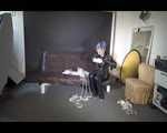 Watching Mara wearing sexy black rainwear during sorting her ropes for the next bondage session (Video)