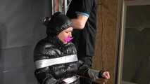 Alice taped to a Chair and tapegagged in shiny nylon Downjacket