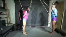 Aiyana and Ms Ungeniert in shiny nylon Shorts and Windbreaker tied and gagged together